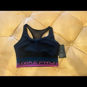 NWT Nike sports bra with lightly padded removable insert.